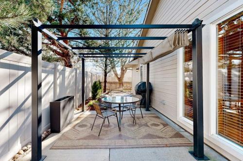 a patio with a table and chairs on a house at Warm & Inviting in Boise