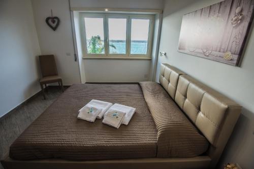 Ένα ή περισσότερα κρεβάτια σε δωμάτιο στο La Casa del Porto Apartment