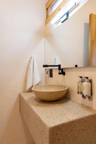 a bathroom with a bowl sink on a counter at PH POINTE · Luxury Penthouse with Pool in Brisas de Zicatela