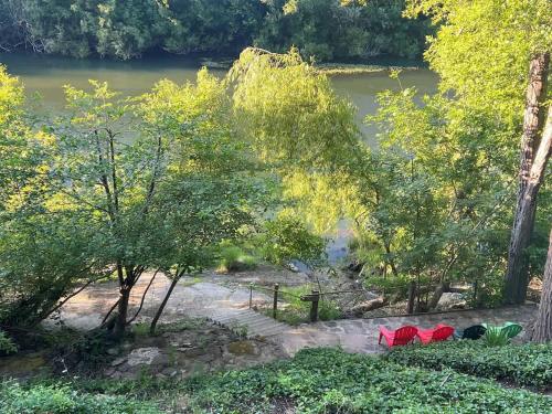 a view of a river from a park with trees at Heron House - Hot Tub And Wine Tastings Included in Healdsburg