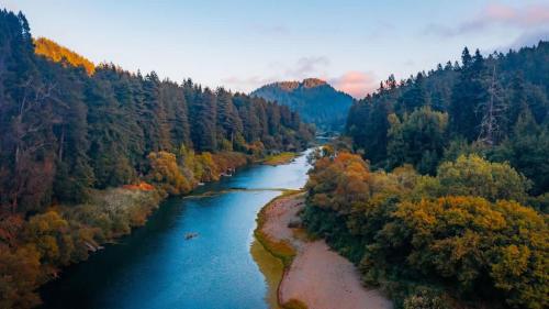 an aerial view of a river in a forest at River View Lodge - Hot Tub And Tastings Included in Healdsburg