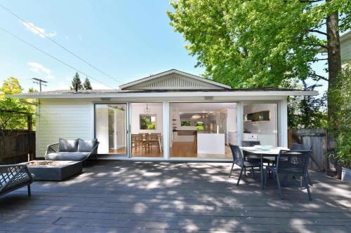 a patio with a table and chairs and a house at Fitch St Escape - Wine Tastings Included in Healdsburg