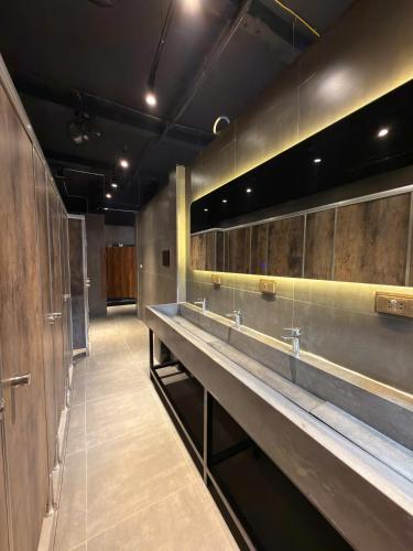 a row of sinks in a public restroom at Factor Inn - Old Quarter Centre in Hanoi