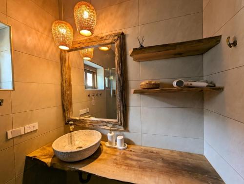 a bathroom with a sink and a mirror at Mint Lotus Resort - Koh Kood in Ban Bang Bao