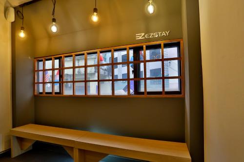 a window in a room with a wooden bench at Ezstay-Nampo in Busan