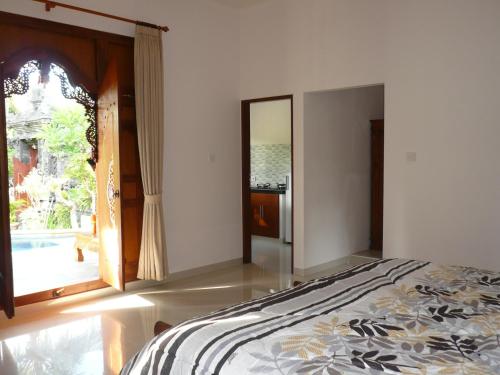 Katil atau katil-katil dalam bilik di Di Abian Villas