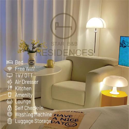 a living room with a couch and a chair and a table at Little Suite Daegu-Central Residential Hotel in Daegu