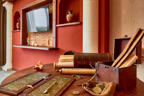 a table with a bunch of items on it at Hotel del Sole in Pompei