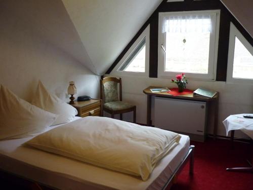En eller flere senger på et rom på Hotel zur Winzergenossenschaft