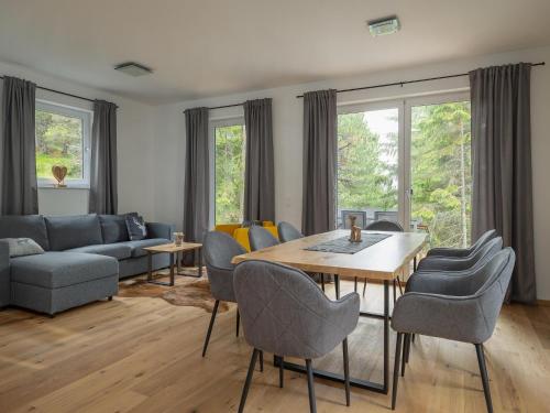 a living room with a table and chairs at Chalet in Turracher Höhe with Ski Slope Access in Turracher Hohe