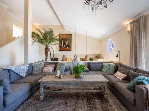 a living room with a couch and a table at Nice Villa in Budens with pool in Budens