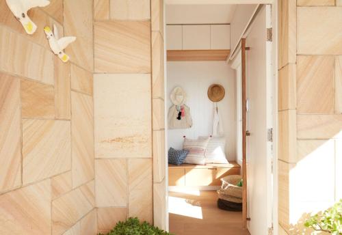 a room with a barn door in a house at The Palms in Palm Beach