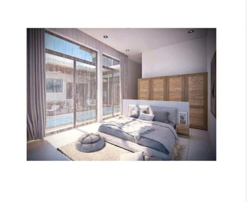 a bedroom with a bed and a large window at Luxurious Villa with Private Indoor Pool in Bophut