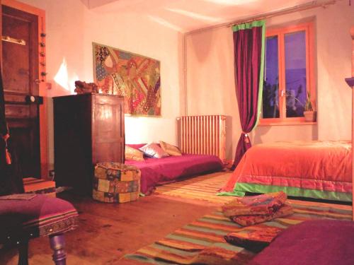 Postel nebo postele na pokoji v ubytování Chambres d'Hotes La Mystérieuse