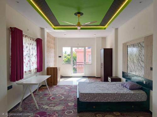 a bedroom with a bed and a ceiling at Sas Tower Hotel in Trincomalee