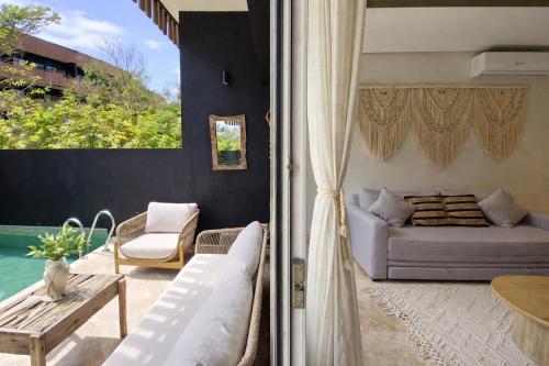 a living room with a couch and a table at Private Pool with Beach Access and Baby Crib - Tulum Hotel Zone in Tulum