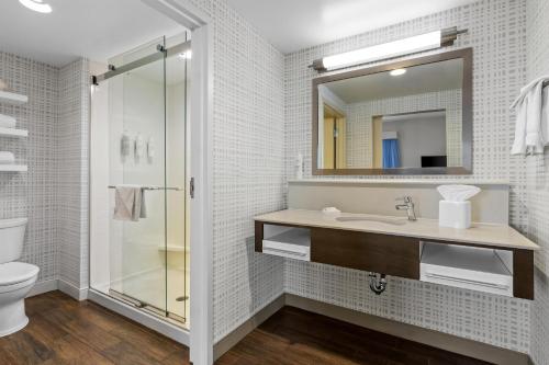 a bathroom with a sink and a shower at Hampton Inn & Suites Claremore in Claremore