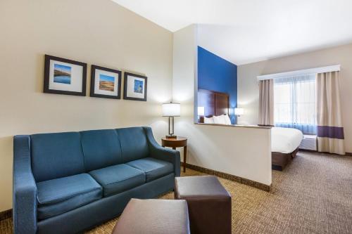 a hotel room with a couch and a bed at Comfort Inn and Suites Yuma I-8 in Yuma