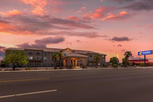 a hotel on a city street with a sunset at Comfort Inn and Suites Yuma I-8 in Yuma