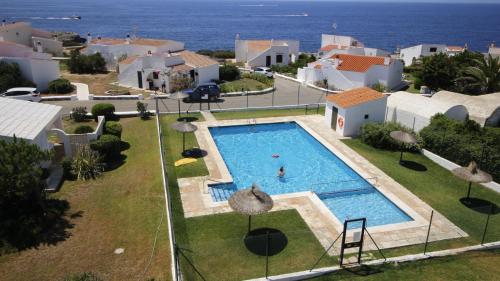 an aerial view of a swimming pool in a house at Binilua in Binibeca