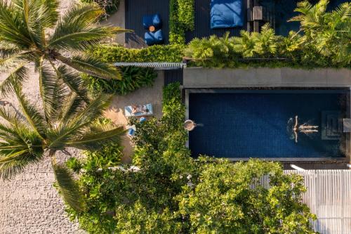 an overhead view of a building with a swimming pool at InterContinental Hua Hin Resort by IHG in Hua Hin