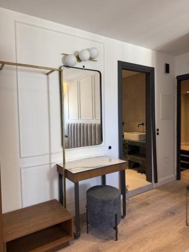 a dressing room with a table and a mirror at Mouragia by Kantoni in Corfu