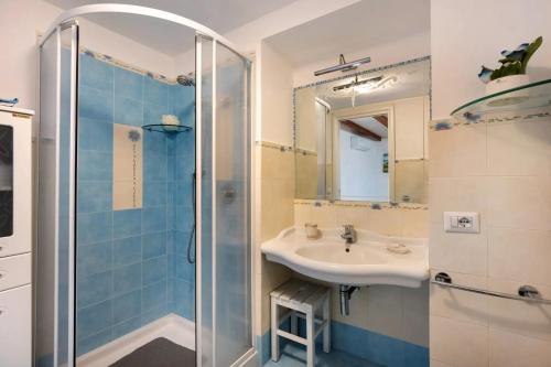 a bathroom with a sink and a shower at La Volta Amalfi Coast in Furore