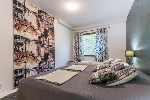 a bedroom with two beds with pillows at Kotokatti in Vuokatti