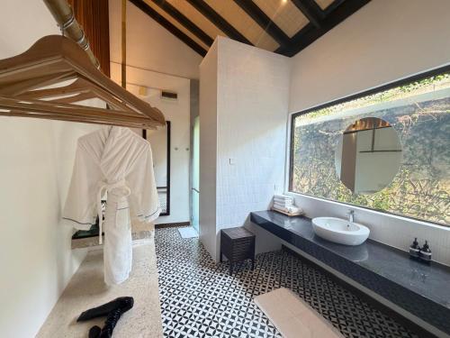 a bathroom with a sink and a mirror at BuBu Villa in Perhentian Islands