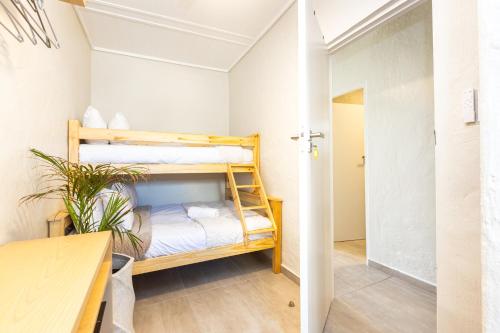 a room with two bunk beds in it at Beach Bliss Pad in Ballito