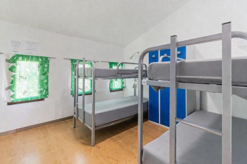 a bunk bed room with two bunk beds in it at Hostel El Castillo in Aniñon