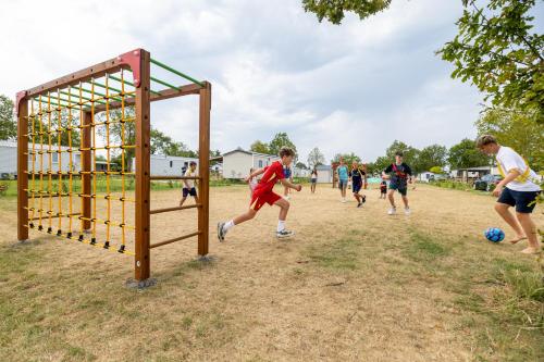 a group of people playing a game of soccer at Siblu Camping de Oase in Renesse