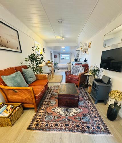 a living room with a couch and a table at Lily s Pad - Private retreat in Lymington, New Forest in Lymington