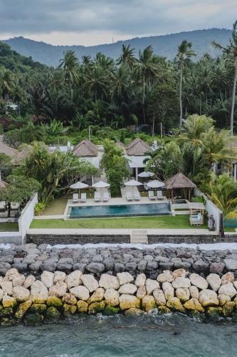 an aerial view of a resort with a swimming pool at Villa Oceana, Candidasa in Candidasa