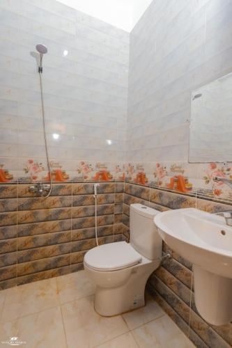 a bathroom with a toilet and a sink at The Sea side camp nuweiba in Nuweiba