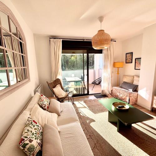 a living room with a couch and a table at Brisa Marela in Sanxenxo