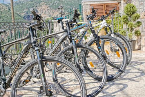 a group of bikes parked next to a fence at Treanto Nafpaktos Boutique Hotel in Nafpaktos
