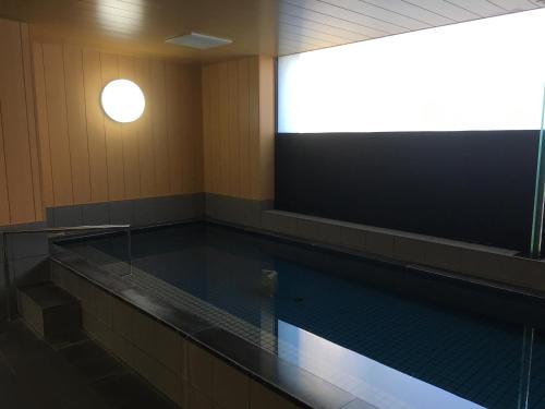 an empty swimming pool in a gymnasium at Hotel Crown Hills Kanazawa in Kanazawa