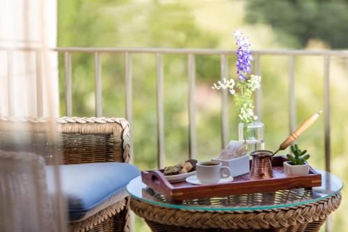 a table with a tray with a trayasteryasteryasteryasteryasteryasteryasteryastery at Chtaura Park Hotel in Chtaura
