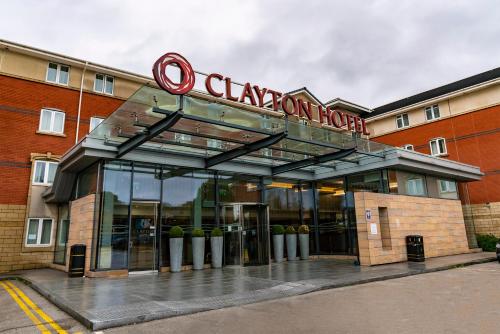 a building with a sign on top of it at Clayton Hotel, Manchester Airport in Hale