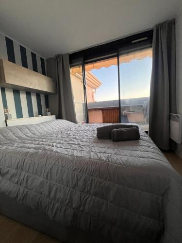 Llit o llits en una habitació de La Perla del Mare