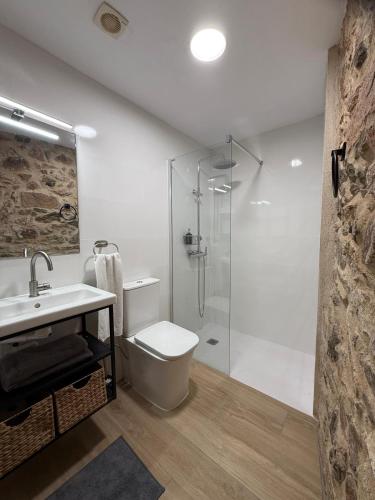 a bathroom with a shower and a toilet and a sink at Nova Forest Montseny in Montseny