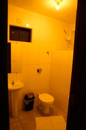 a bathroom with a toilet and a sink at Casas 1 Terrace in Laguna