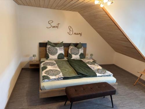 a bedroom with a bed in a attic at Ferienwohnung Lodge 13 in Ehrenberg