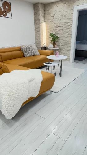 a living room with a couch and a table at Alia house with garden in Piešťany in Piešťany