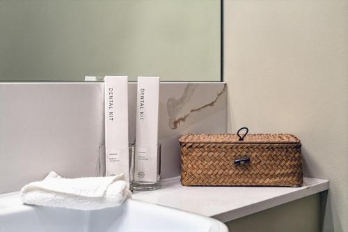a bathroom with two books and a basket on a counter at The Malt Store in Birr