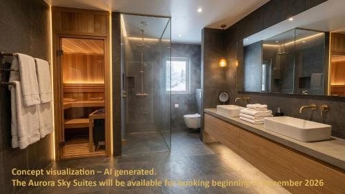 a bathroom with a glass shower and a sink at Arctic Panorama Lodge in Uløybukta
