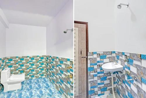 a bathroom with a toilet and a sink at Hotel o Skylight in New Delhi