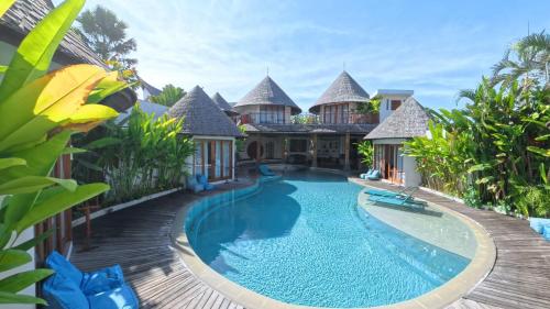 an image of a villa with a swimming pool at Villa Manureva in Canggu