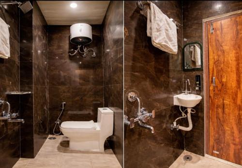 a bathroom with a toilet and a sink at Anushka Stays Varanasi in Varanasi